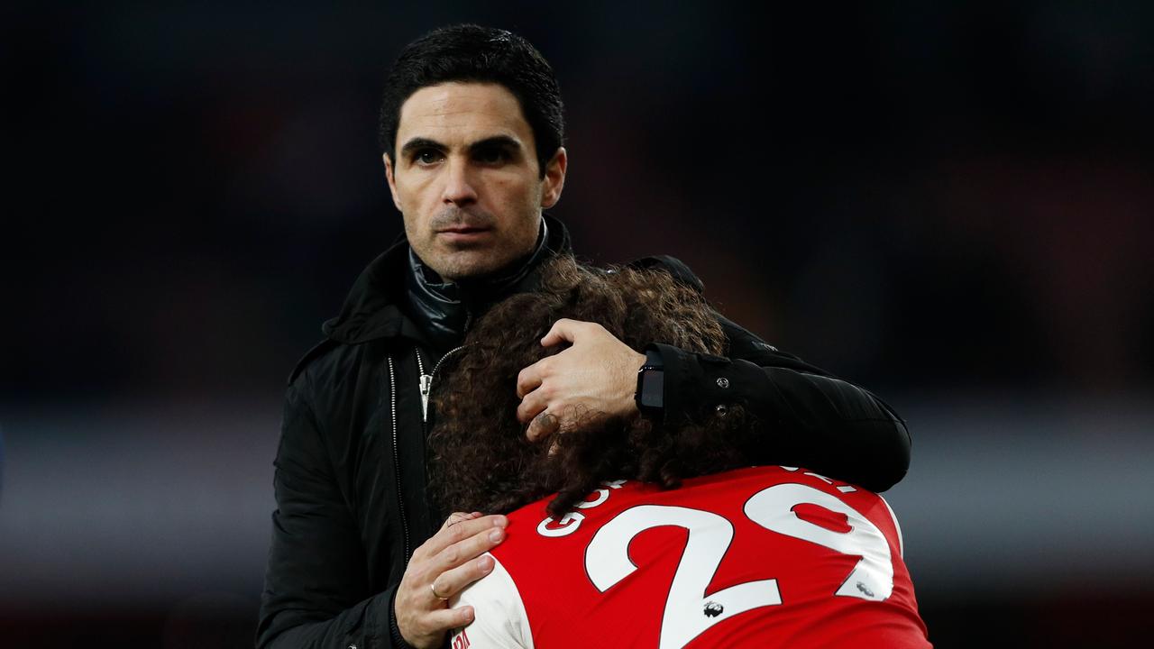 Arsenal coach Mikel Arteta (L) embraces shattered star Matteo Guendouzi (R) after the loss. Picture: AFP