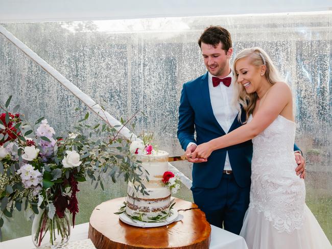 Lauren and James were undaunted by the great storm. Picture: Andrea Laube