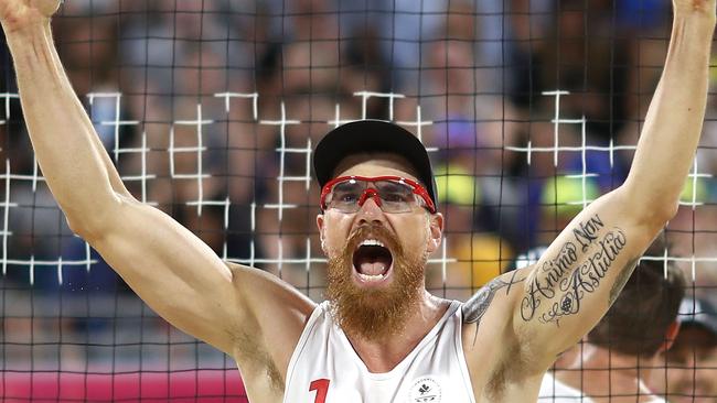 Samuel Pedlow celebrates victory over New Zealand in the beach volleyball semi-final. Picture: Getty Images.