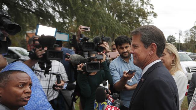 Georgia Republican candidate Brian Kemp speaks to reporters after voting in Winterville, Georgia. Kemp is in a close race with Democrat Stacey Abrams. (AP Photo/John Bazemore)