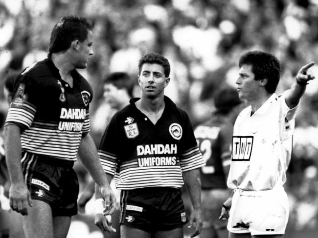 Referee Bill Harrigan gives Mark Geyer (left) clear instructions in the 1991 decider as captain Greg Alexander looks on.