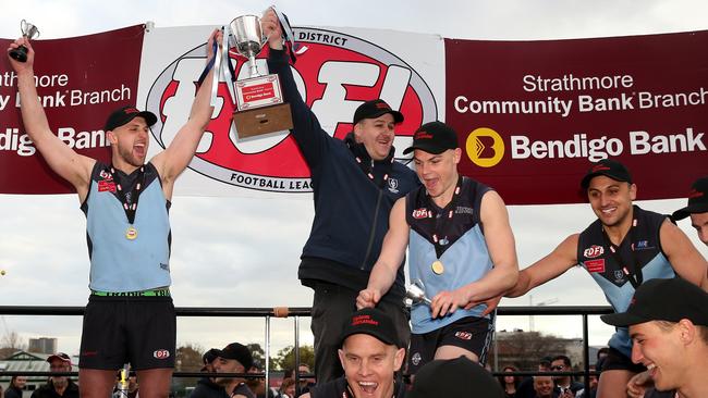 Captain Luke Davis and co-coach Adam Potter hoist the silverware. Picture: Mark Dadswell