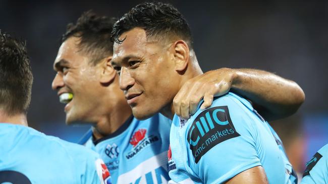 Karmichael Hunt (left) has thrown his support behind former teammate Israel Folau playing in the Intrust Super Cup. Picture: Getty Images