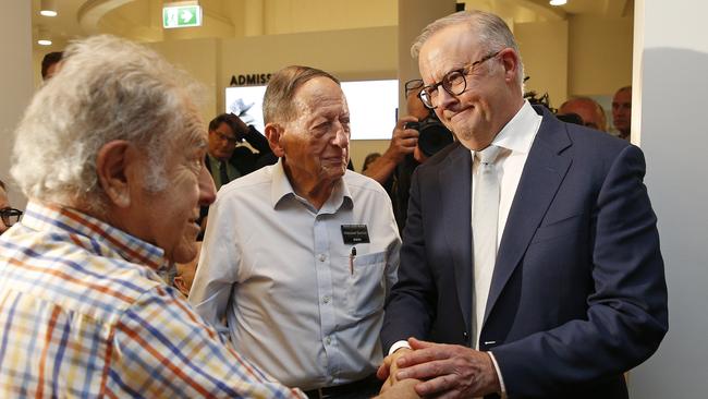 Anthony Albanese comforts Holocaust survivors Eddie Friedlander and Egon Sonnenschein at the Sydney Jewish Museum.