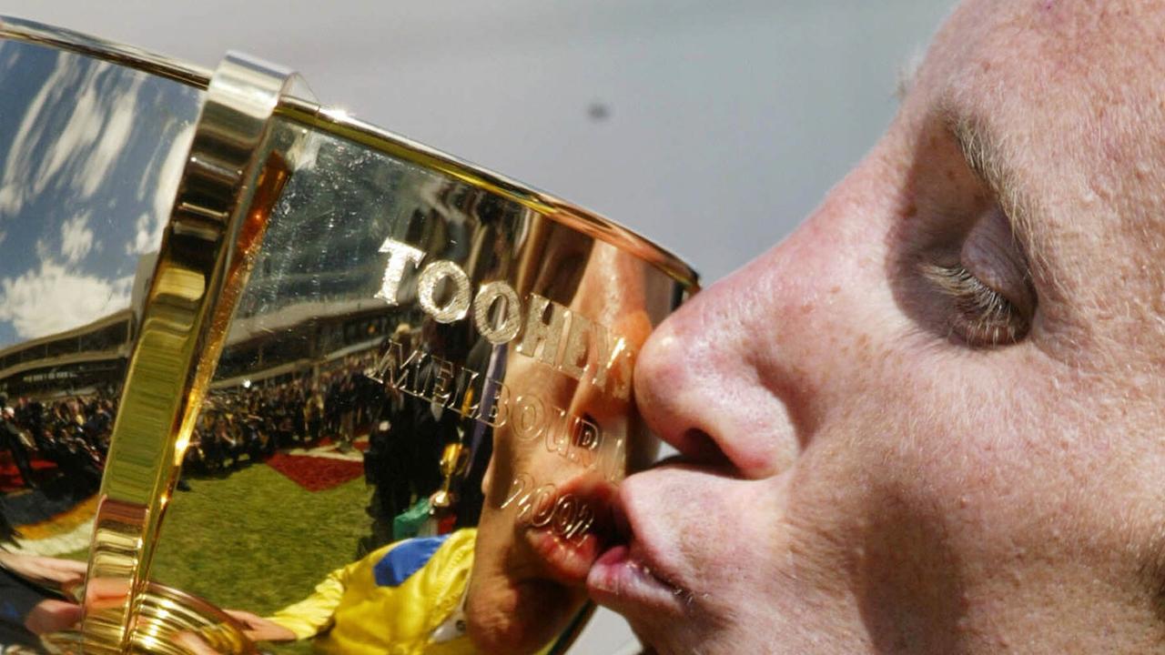05/11/2002. Damien Oliver, who won the 2002 Melbourne Cup on Media Puzzle kisses the cup. Digital Image