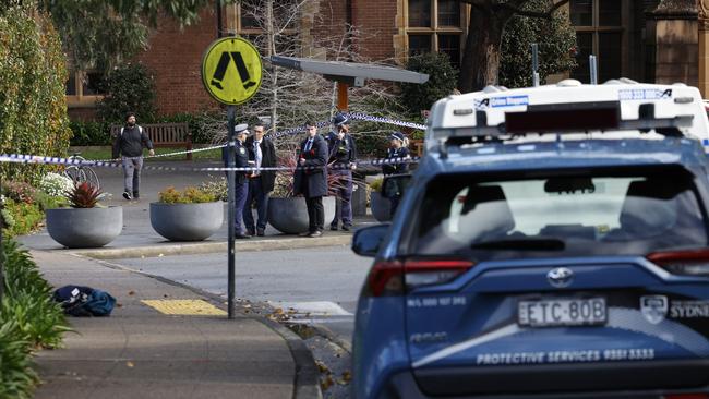 Police at the scene of the alleged stabbing on the grounds of Sydney University at Camperdown. Picture: Richard Dobson