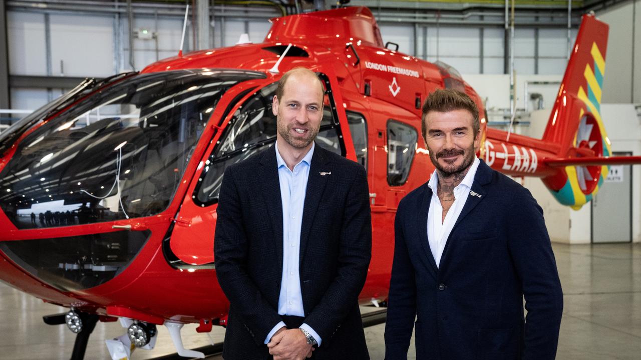 Prince William, Prince of Wales (left) with David Beckham in front of one of the new London Air Ambulance Charity helicopters. Picture: Getty