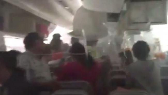 Panic ... Inside the cabin of flight EK521 after crash landing in Dubai. Picture: Supplied