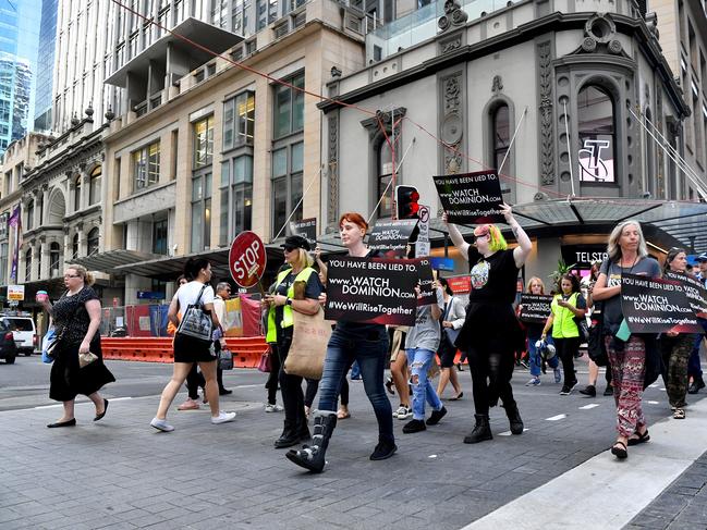 Animal rights protesters march through the business district in Sydney. Picture: AAP