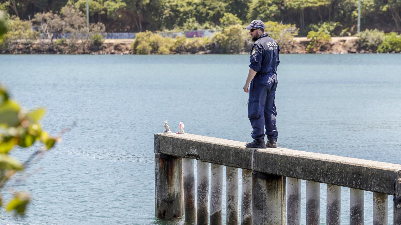 NSW Police Public Order and Riot Squad members search the banks of the Tweed River for evidence in 2018. (AAP Image/Tim Marsden)