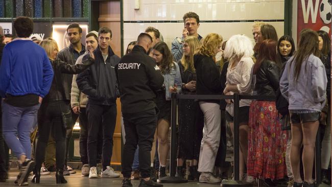 Queues outside a pub in Newtown. Picture: Dean Asher