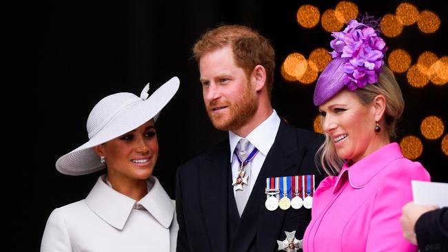 Prince Harry, Duke of Sussex, Meghan, Duchess of Sussex, and Zara Tindall leave after attending the National Service of Thanksgiving at St Paul's Cathedral during the Queen's Platinum Jubilee celebrations on June 3, 2022 in London, England. (Photo by Toby Melville – WPA Pool/Getty Images)