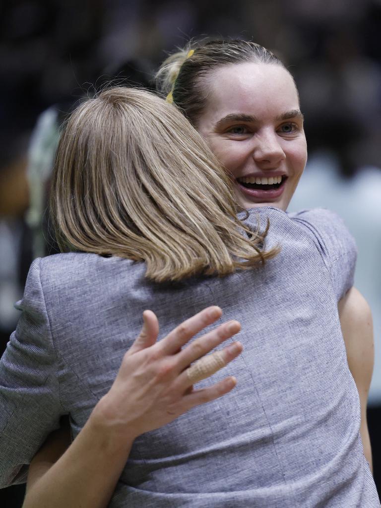 Kiera Austin hugs assistant coach Nicole Richardson after the win. Picture: Getty Images