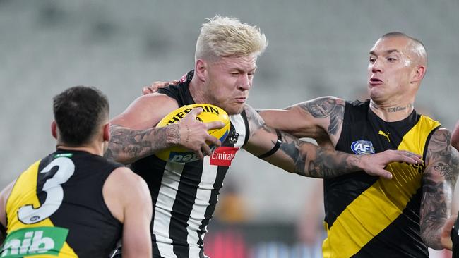 Jordan De Goey clashes with Dustin Martin during the 2020 season but is a long way off reaching the superstar standards set by the Tiger Brownlow Medallist.