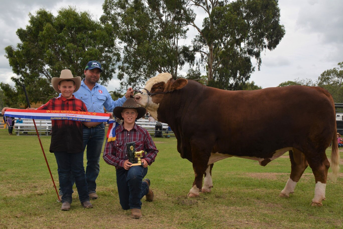 Mitchell and Rohan Duncombe with Marty Rowlands and the Grand Champion exhibit of the Cooyar Show, the magnificent KBV Penfold a bull in his very own class. Picture: Kate McCormack