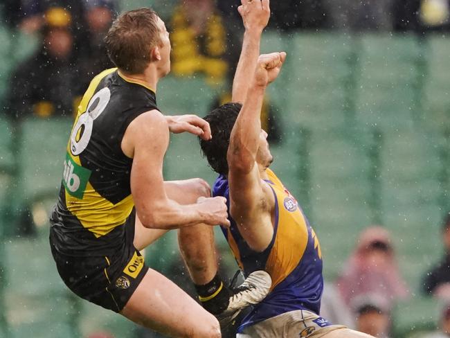 Jack Riewoldt was penalised for this attempted mark over Tom Barrass. Pic: AAP