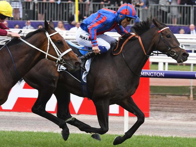 Michael Walker and A Prince Of Arran combine to win the Lexus Stakes.