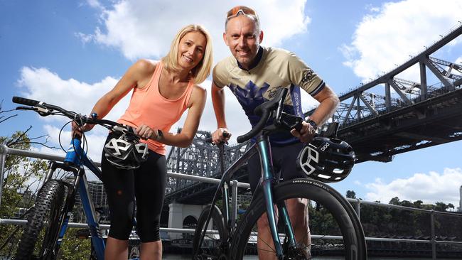 Perry Judd with wife Lidija Judd, preparing for the Tour de Brisbane. Picture: Liam Kidston