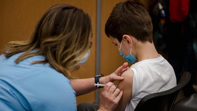 A child in Canada receives the Pfizer Covid-19 vaccine. Picture: Andrej Ivanov / AFP