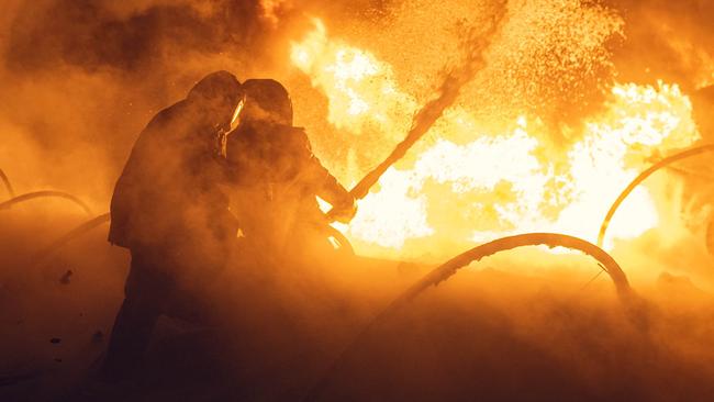 Firefighters attempt to extinguish a fire in eastern Ukraine’s Sumy region following a Russian strike. Picture: Ukraine Emergency Service/AFP