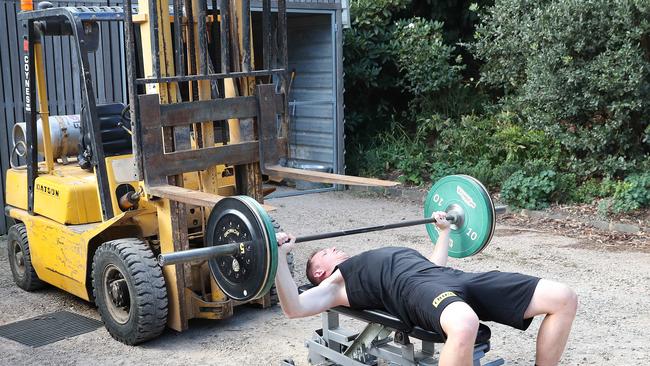 The winery forklift also serves as a bench press and squat rack as Grimes trains in isolation. Picture: Michael Klein