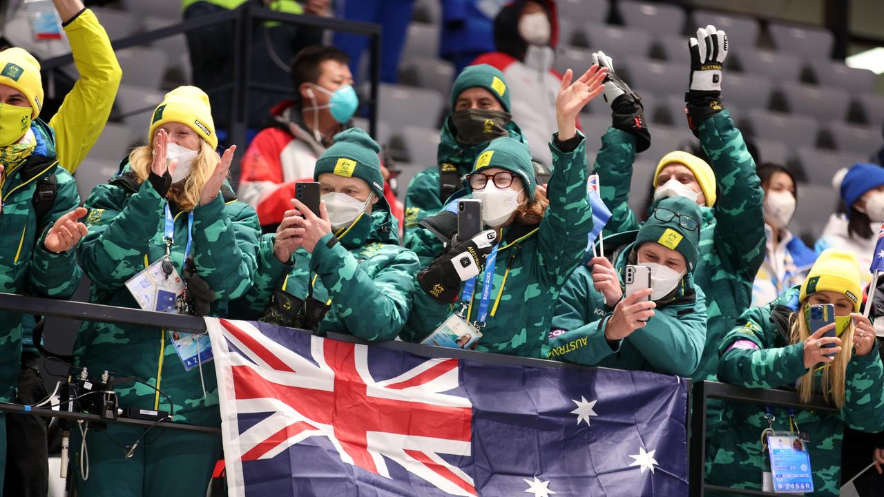 Australian team members cheer as Narracott claims silver. Picture: Getty Images