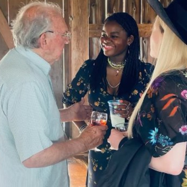 Madonna and daughter Mercy chat to Madonna’s father Tony.