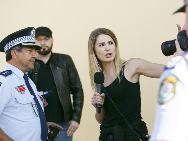 Police stop Lauren Southern and her crew as they approach the Lakemba Mosque. Picture: Tim Pascoe