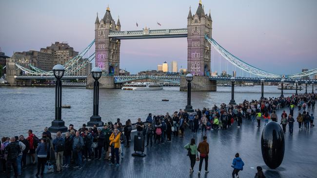 People queue past Tower Bridge as they wait to pay their respects. Picture: Carl Court/Getty Images