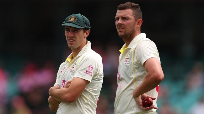 Pat Cummins and Josh Hazlewood will get their chance to get revenge on Robinson. Picture: Getty