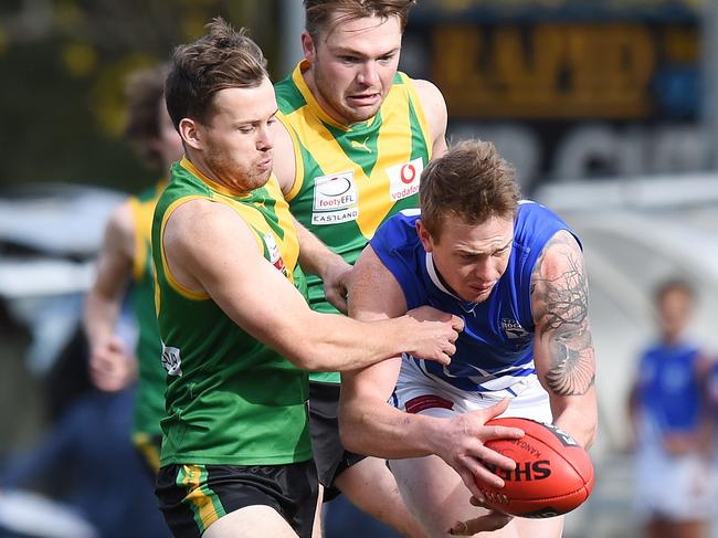 East Ringwood's Jarryd Ambrose is tackled by Bayswater's Hayden Schroeder. Picture: Josie Hayden