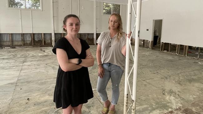 Deja Vu Mannum owner Kylie Rochow and staff member Jemma Gurr inside the empty store as the clean up begins. Picture: Dylan Hogarth.