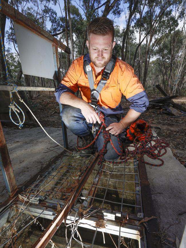 Underground miner Nathan Ward on the top of the mine shaft they have been searching. Picture: Alex Coppel.