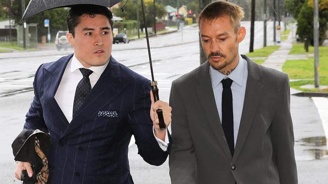 Silverchair frontman Daniel Johns, right, arrives at Raymond Terrace Court for sentencing on Wednesday. Picture: Peter Lorimer.