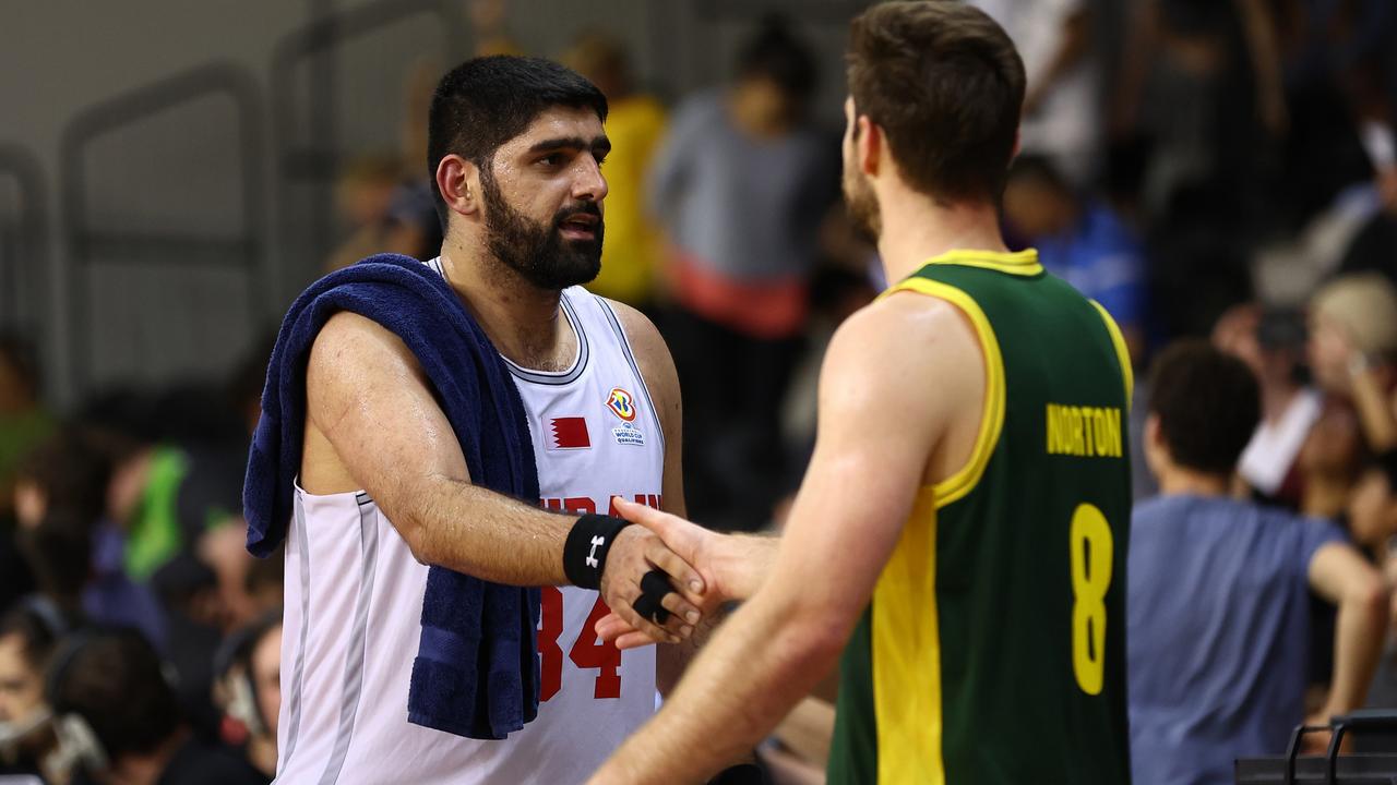 MELBOURNE, AUSTRALIA - FEBRUARY 23: Ali Hasan of Bahrain (L) shakes hands with Mitchell Norton of Australia during the FIBA World Cup Qualification match between the Australia Boomers and Bahrain at State Basketball Centre on February 23, 2023 in Melbourne, Australia. (Photo by Graham Denholm/Getty Images)