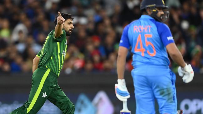 MELBOURNE, AUSTRALIA - OCTOBER 23: Haris Rauf of Pakistan celebrates getting the wicket of Rohit Sharma of India bats during the ICC Men's T20 World Cup match between India and Pakistan at Melbourne Cricket Ground on October 23, 2022 in Melbourne, Australia. (Photo by Quinn Rooney/Getty Images)