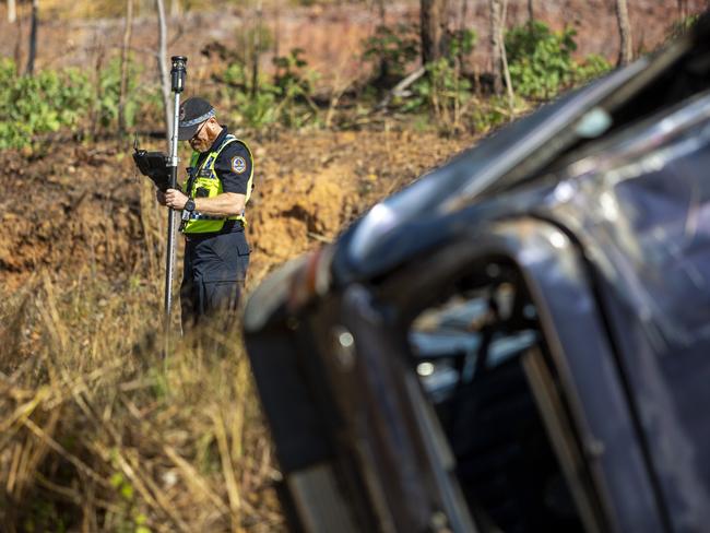 NT Police mark out the scene on the Stuart Hwy in front of the crash wreckage at Manton Dam. Picture: Floss Adams. GENERIC NT CRASH IMAGE