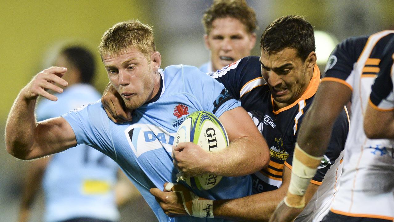Tom Staniforth of the Waratahs is tackled by Rory Arnold of the Brumbies in 2018.