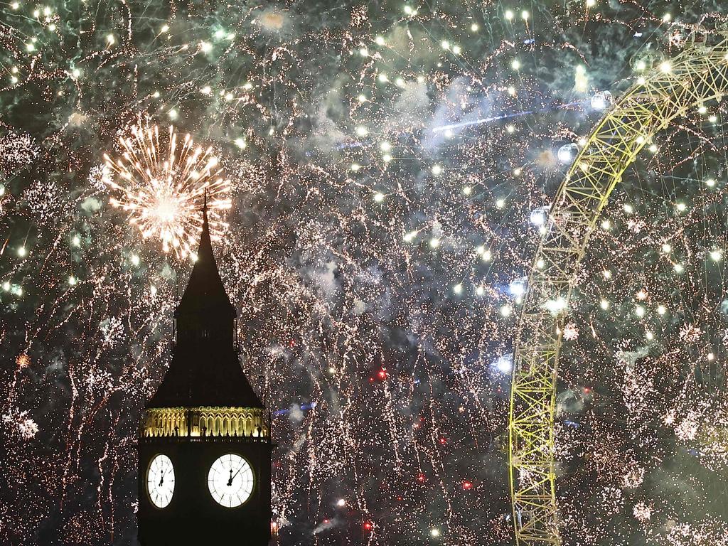 Fireworks explode around the London Eye and The Elizabeth Tower, commonly known by the name of the clock's bell, Big Ben. Picture: AFP