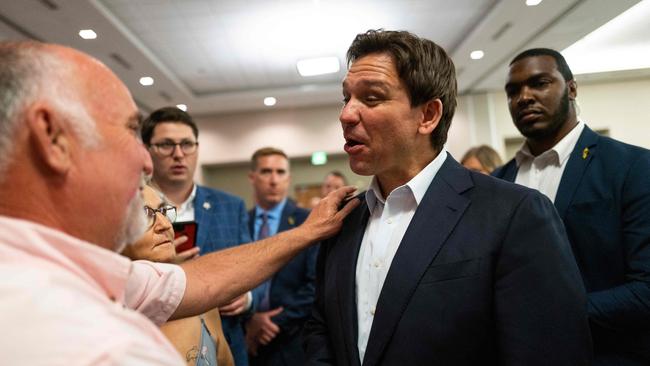 Ron DeSantis speaks with attendees at the Iowa GOP reception in Cedar Rapids. Picture: Getty Images/AFP