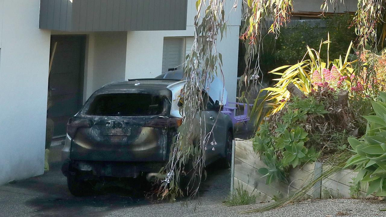 A car destroyed by fire in the driveway of a Jan Juc house in Marner Close. Picture: Alison Wynd