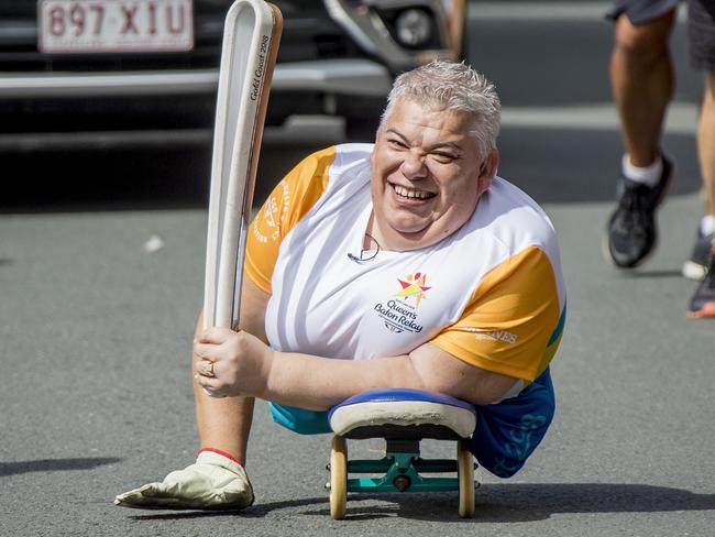 Baton Bearer   John Coutis carrying the QueenÕs Baton  in Surfers Paradise on the last day of the relay ahead of the official start to the  2018 Gold Coast Commonwealth Games.    Picture: Jerad Williams