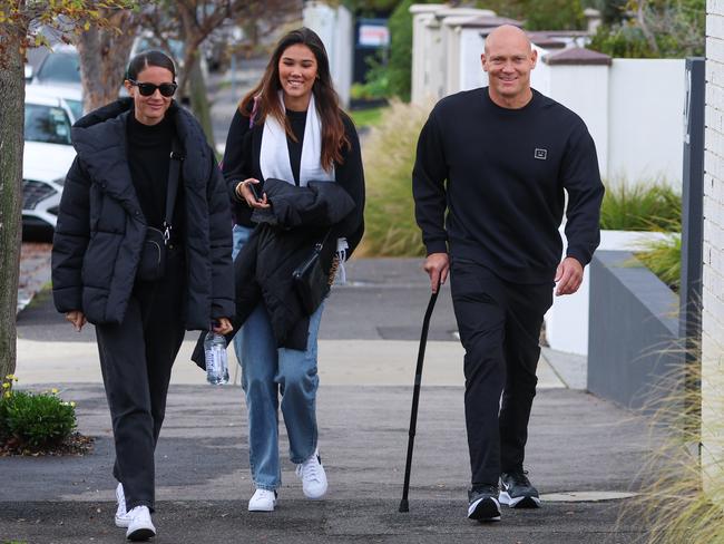 Michael Klim with his partner Michelle Owen and daughter Stella. Klim is unable to walk unassisted. Picture: Brendan Beckett