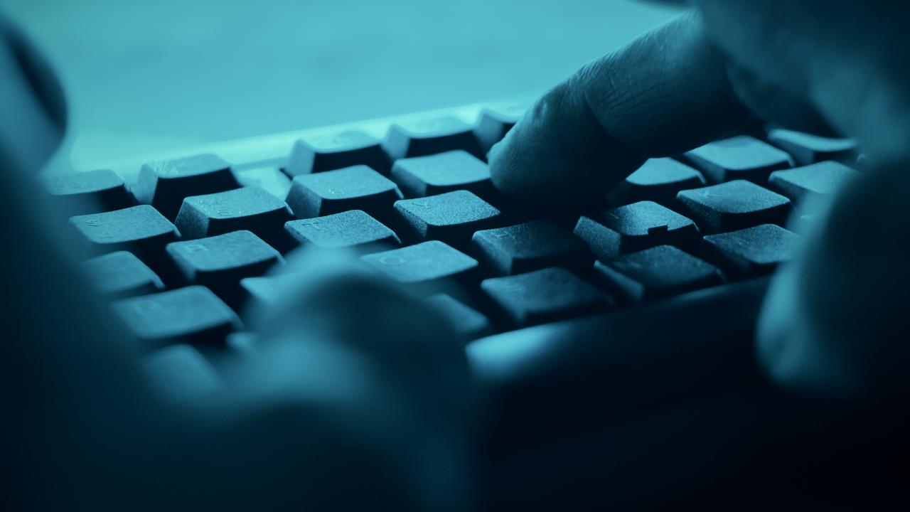 A stock image of a person typing on a keyboard.