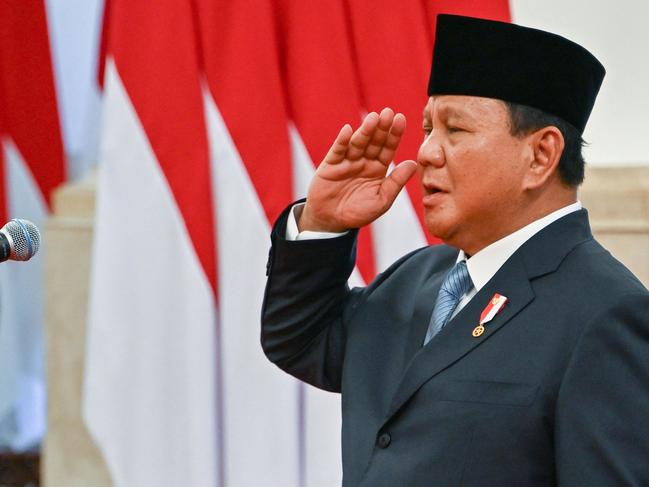 Indonesia's President Prabowo Subianto presides over the swearing-in ceremony of his cabinet ministers at the Presidential Palace in Jakarta on October 21, 2024. Newly inaugurated Indonesian President Prabowo Subianto on October 21 swore in his new cabinet, which includes key members of his predecessor's team and suggests he will continue his main policies, analysts said. (Photo by BAY ISMOYO / AFP)