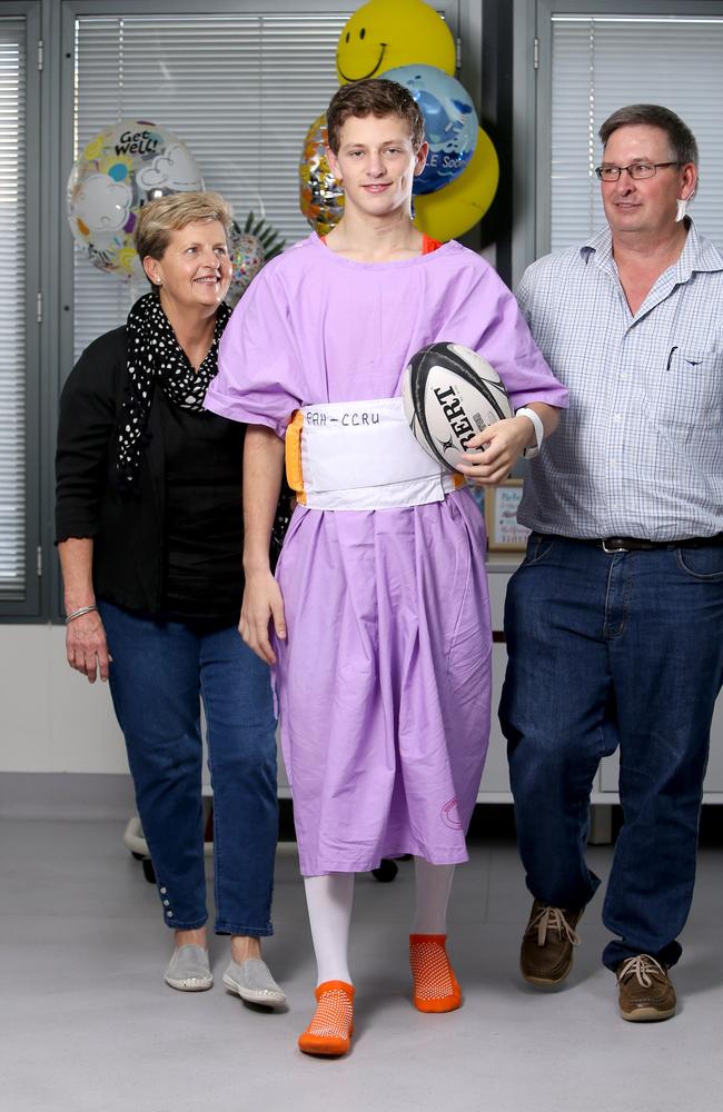 Ollie Bierhoff, 18, with his parents Colleen and Bernie Bierhoff. Picture: AAP Image/Steve Pohlner