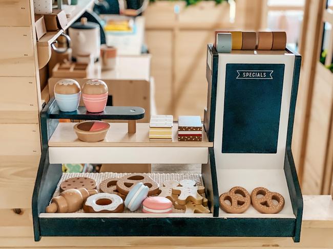 Most of the accessories including the food, utensils and wooden coffee machine (pictured) were form Kmart. Picture: Supplied