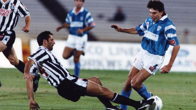 Milan Ivanovic, of Adelaide City, and Stan Lazaridis, of West Adelaide, square off in a National Soccer League derby in 1994.