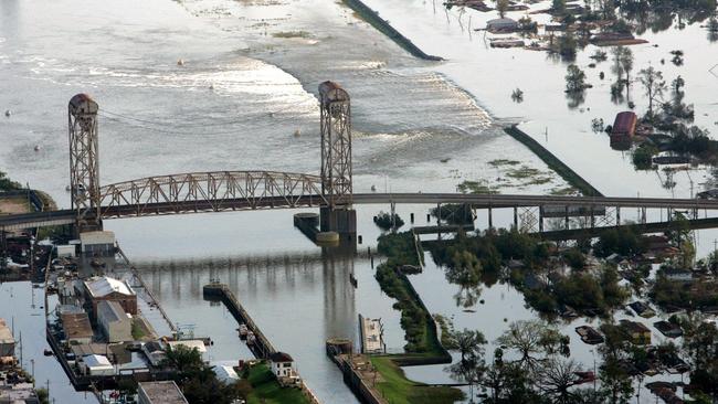 Floodwaters pour over a broken levee in New Orleans on August 30. Picture: Ap