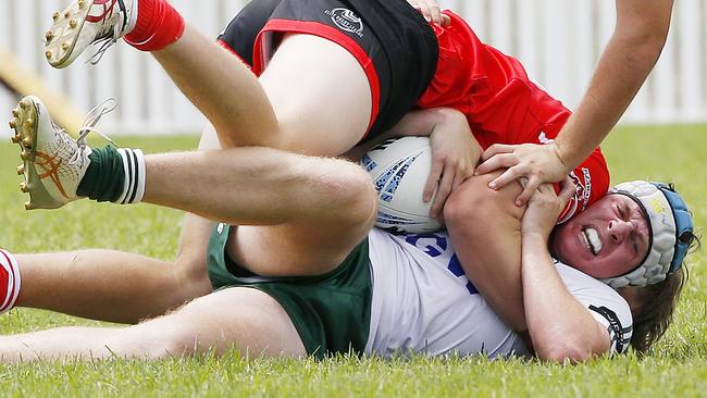 Hayden Buesnel met in a strong tackle. Picture: John Appleyard